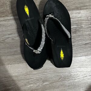 Volatile Black Sandals with Silver Embellishments